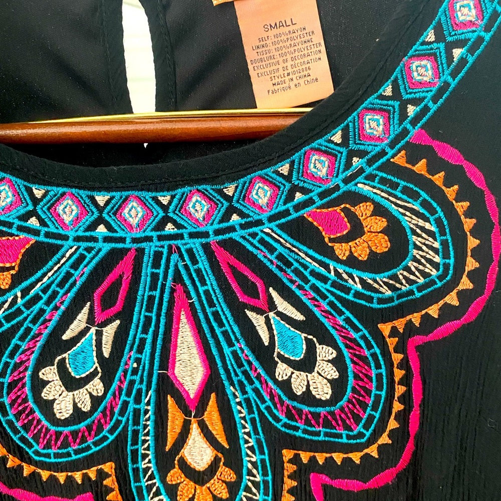 Flying tomato embroidered black dress.